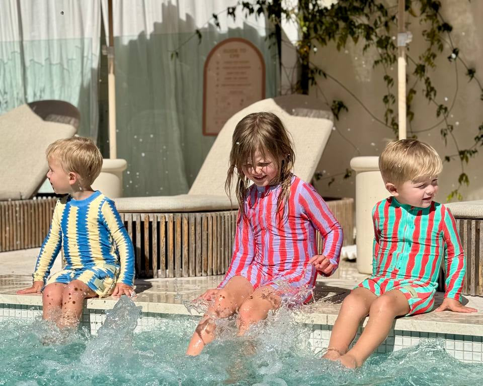 Kids jumping into pool wearing Pekpi Sea Kelp Shorties