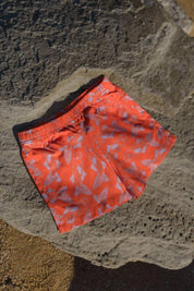 Big Glub Shorts - flat lay on beach rocks front view