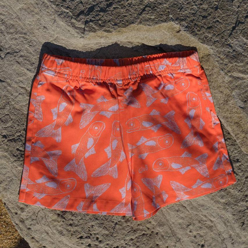 Big Glub Shorts - flat lay on beach rocks back view