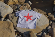 Starfish Tee Crop Purple - flat lay front view on rocks