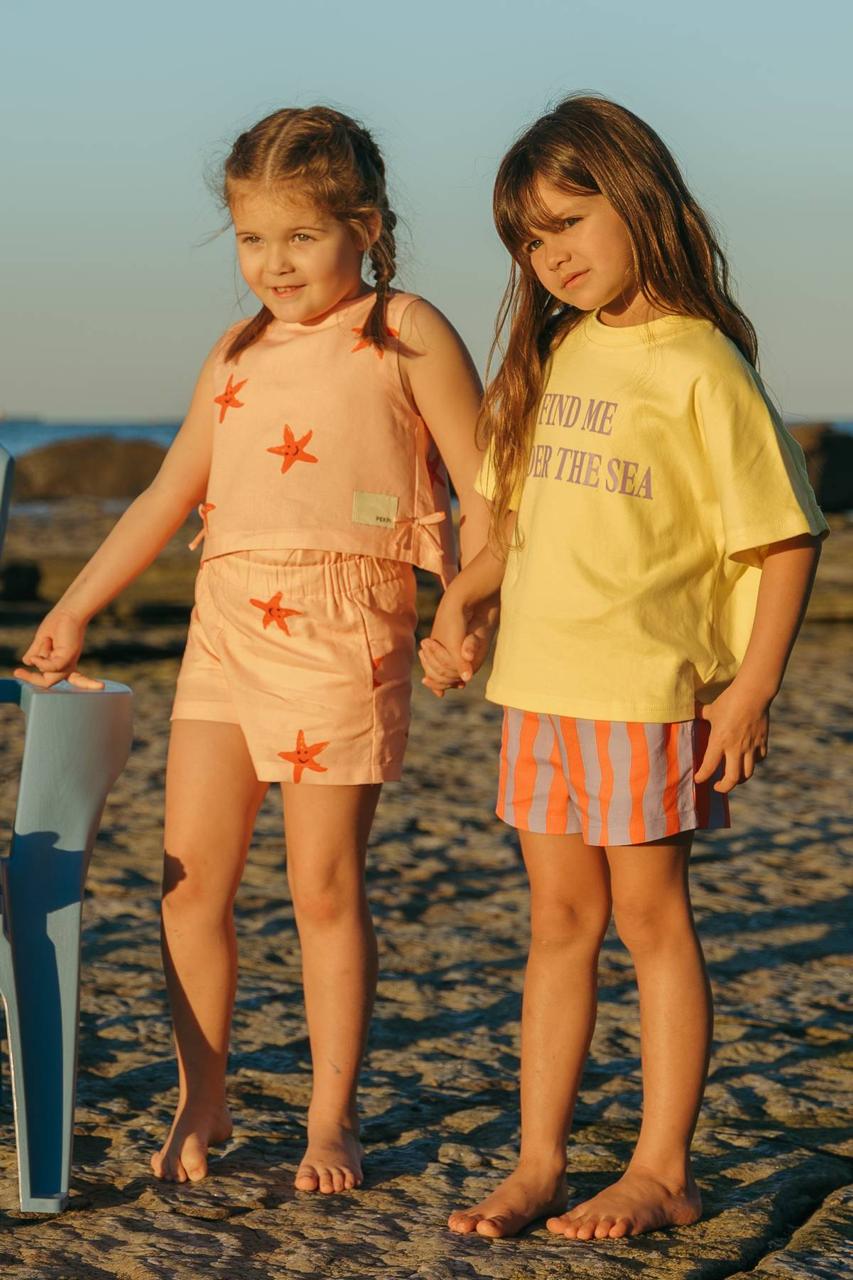 Pipi Shorts - styled outfits siblings at beach golden hour