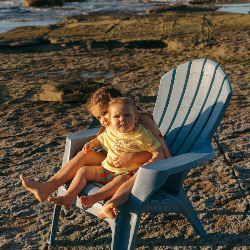 Pipi Shorts - siblings on beach chair golden hour