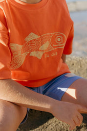 Big Glub Tee - close up fish print on orange tee