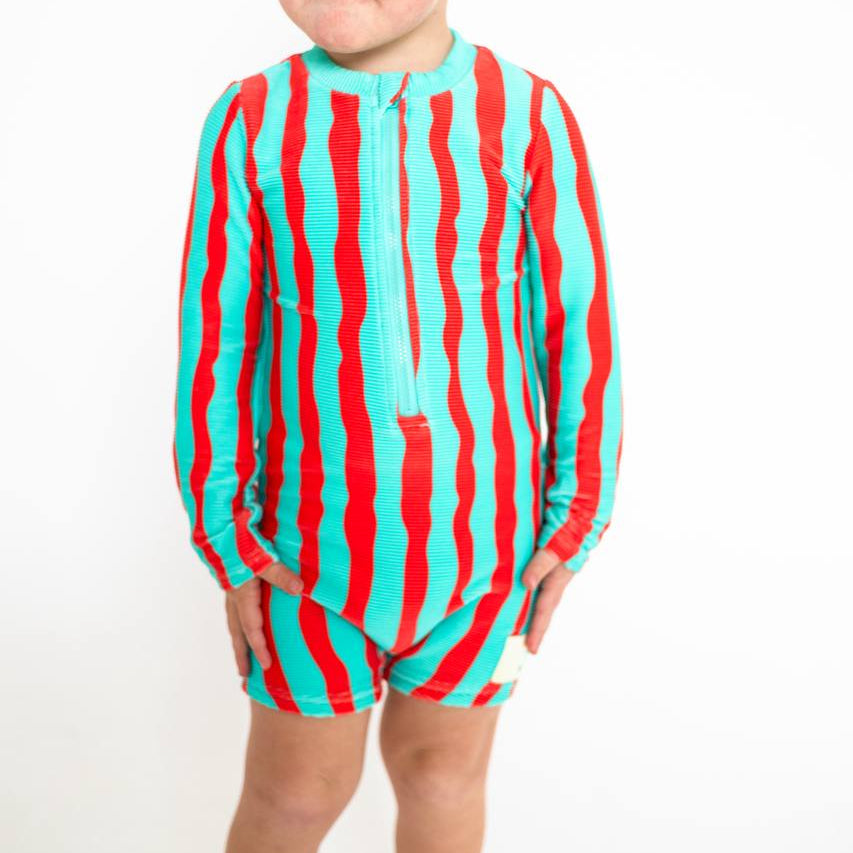 Toddler wearing Sea Kelp Aqua Shortie studio shot