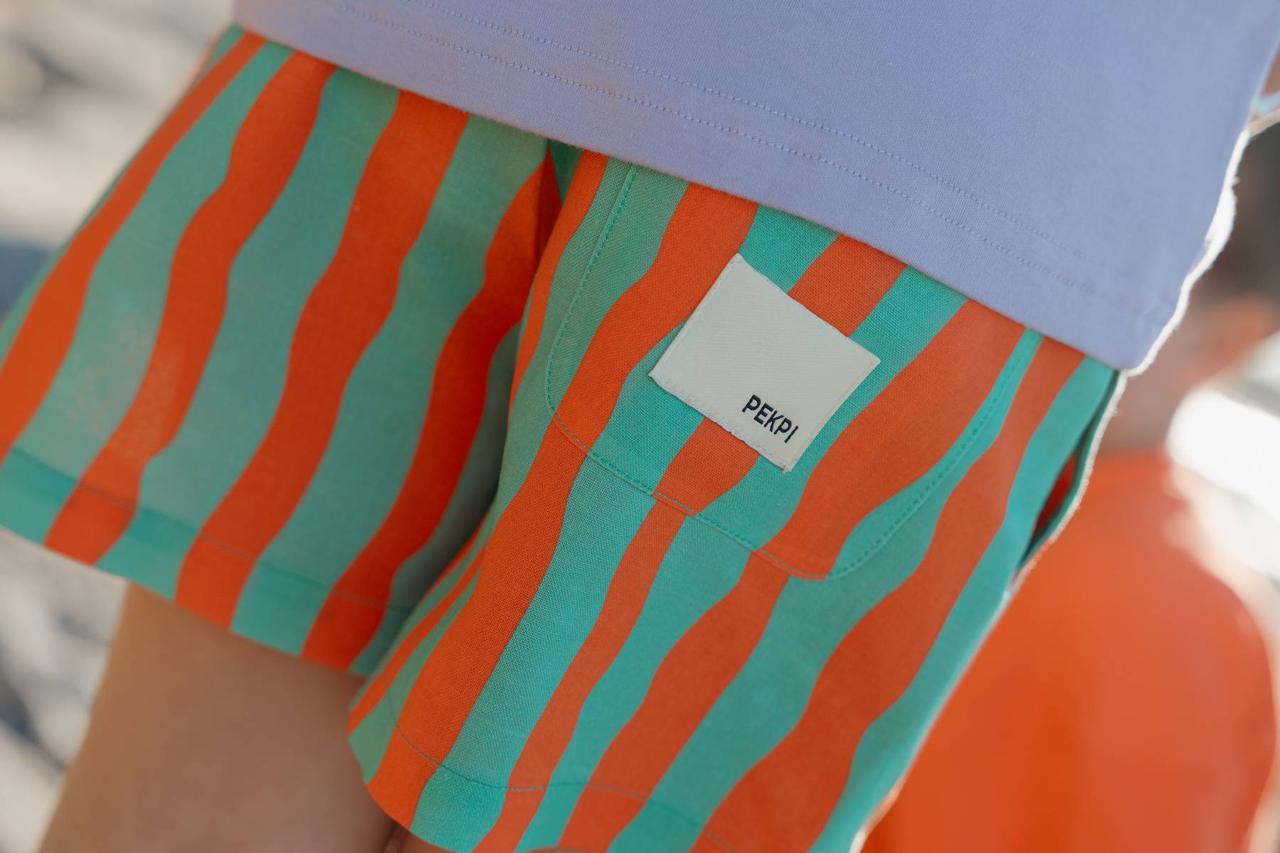 Aqua Shorts - Pekpi label detail close up