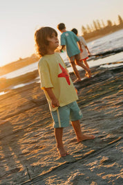 Starfish Tee Yellow - boy on rocks at sunset