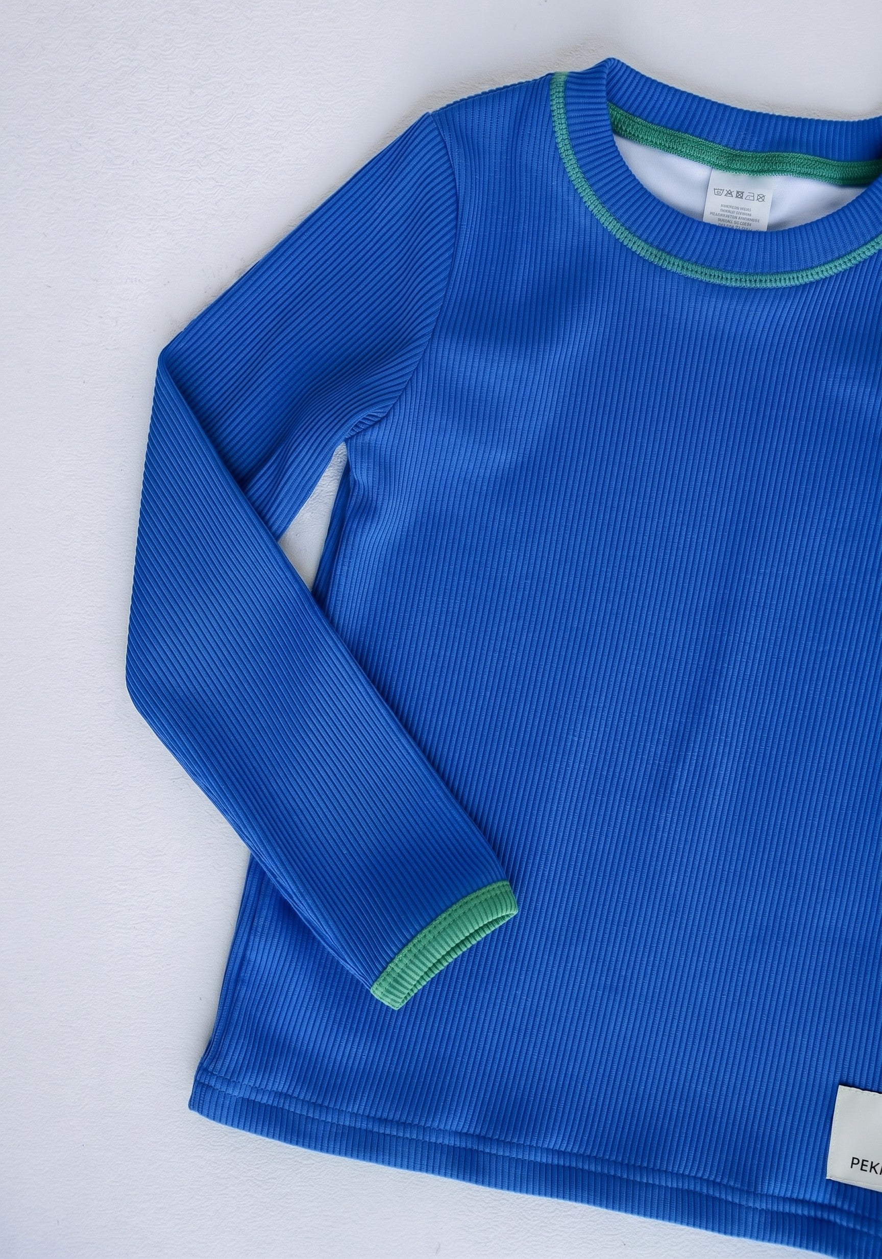Boys rashie top in Bold Blueberry (AI-generated image matched to our sample)