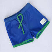 Boys swim shorts in Bold Blueberry (AI-generated image matched to our sample)