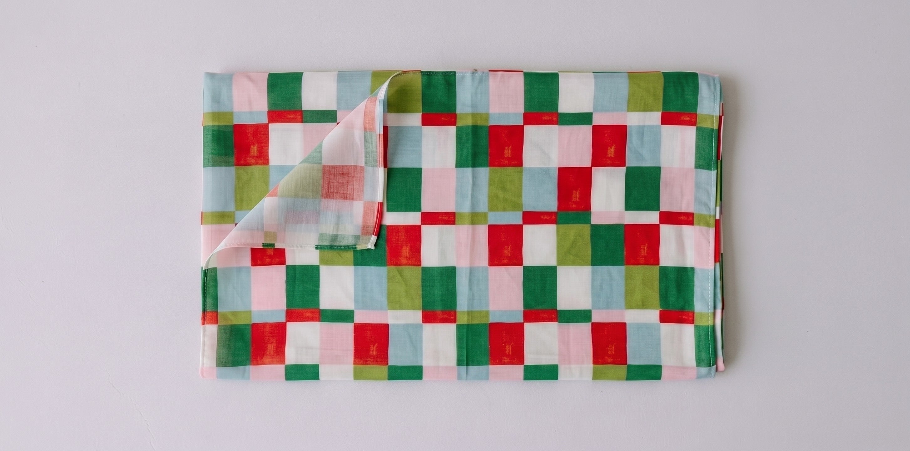 Womens voile sarong in Popsicle Check, folded (AI-generated image matched to our print)