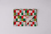 Womens voile sarong in Popsicle Check, folded (AI-generated image matched to our print)