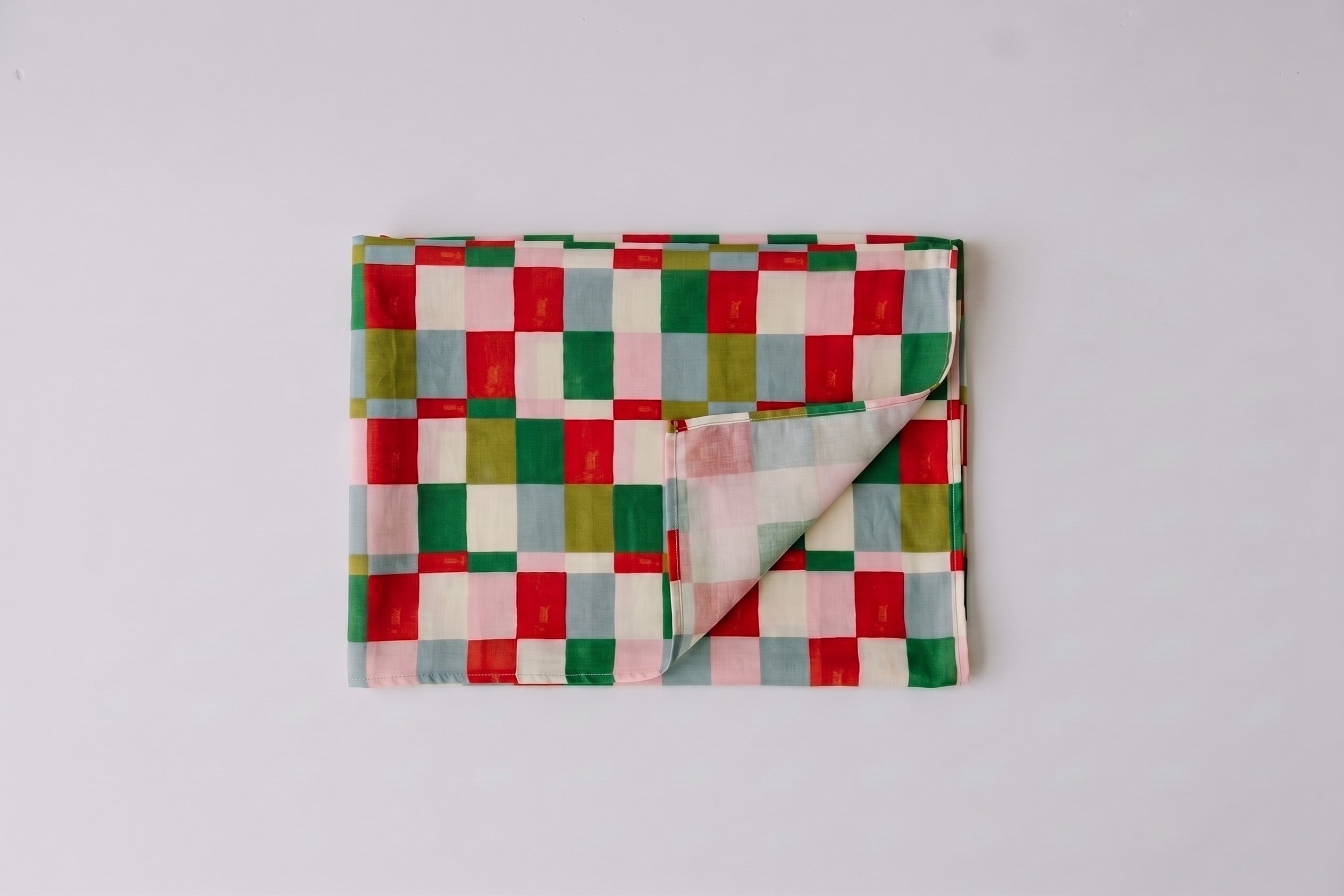 Womens voile sarong in Popsicle Check, folded (AI-generated image matched to our print)