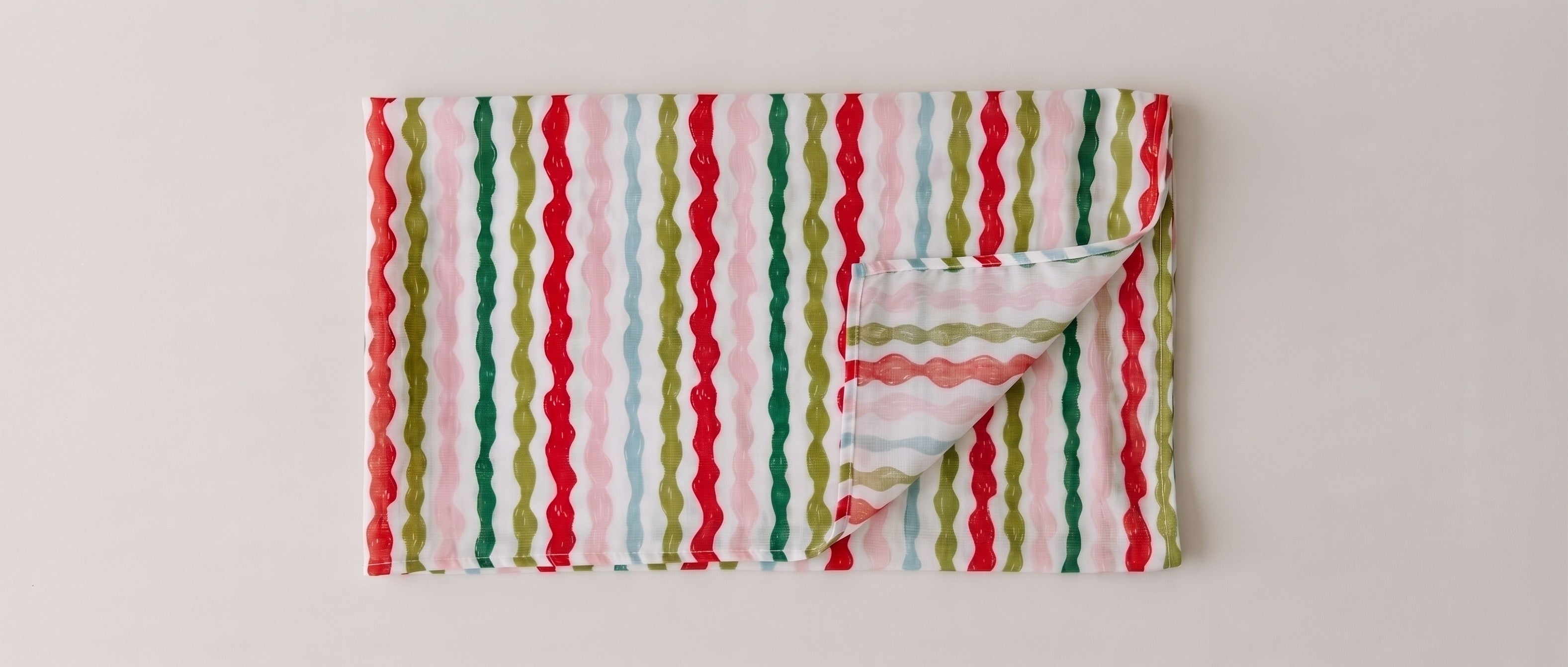Womens voile sarong in Popsicle Wobble Stripe, folded (AI-generated image matched to our print)