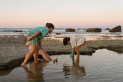 Aqua Shorts - kids playing in rock pools at sunset