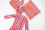 Sea Kelp Pipi Shortie flat lay with swim nappy, bib and wet bag