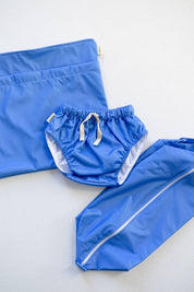 Rockpool swim nappy and wet bags set flat lay