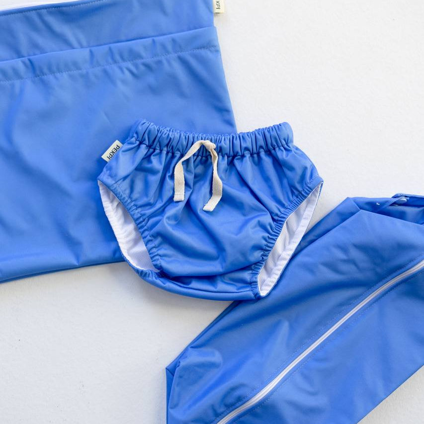 Rockpool swim nappy and wet bags set flat lay