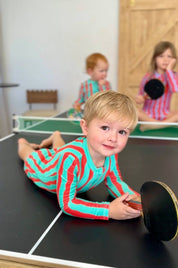 Kids playing ping pong wearing Sea Kelp Aqua Shortie