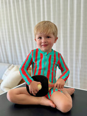 Boy sitting on ping pong table wearing Sea Kelp Aqua Shortie