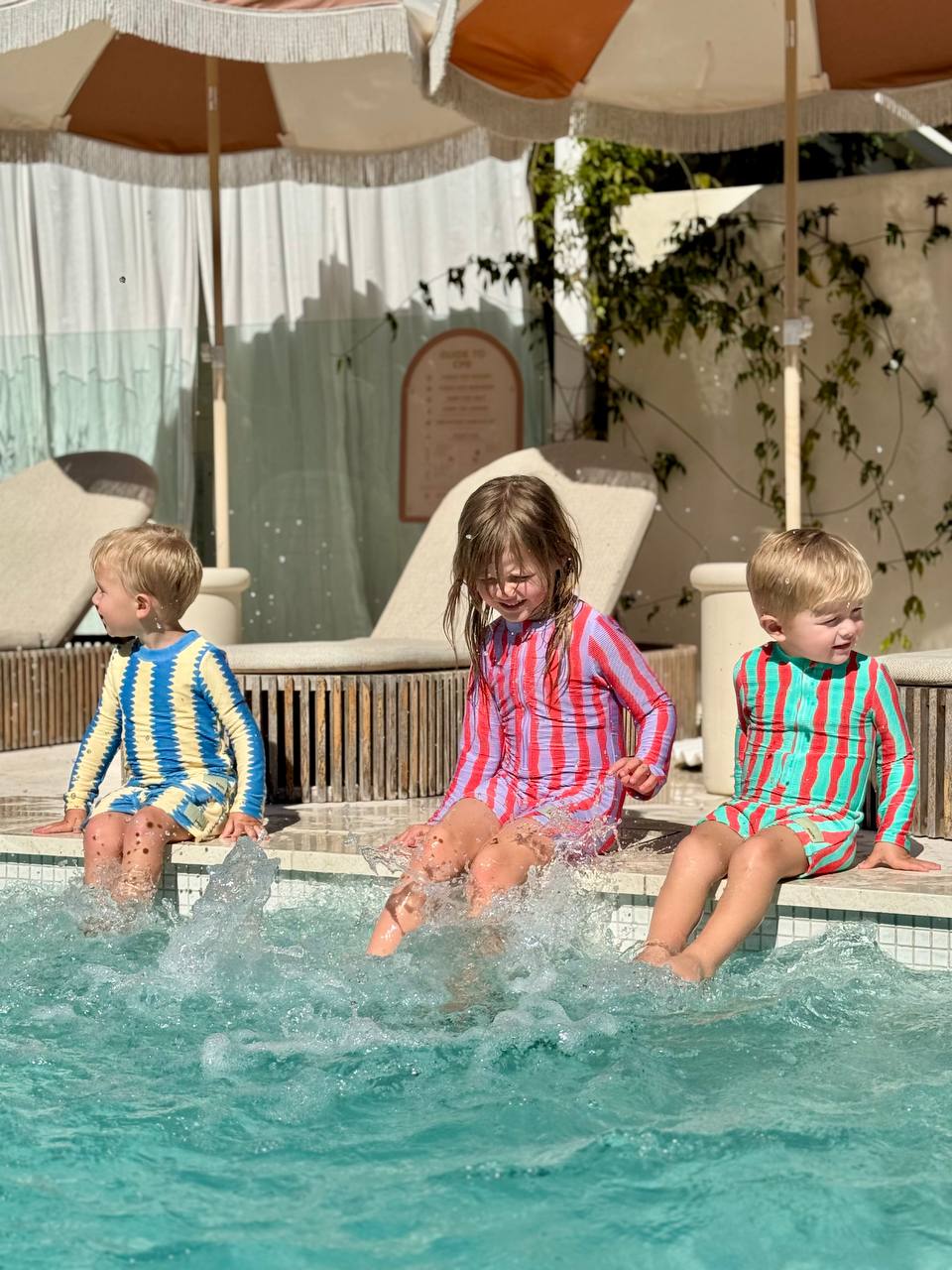 Kids jumping into pool wearing Pekpi Sea Kelp Shorties