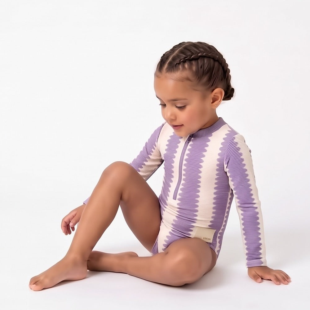 Girls full piece swimsuit in Grape Wobble, seated (AI-generated image matched to our sample)
